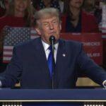 Thune booed as Trump says majority leader is “working hard”